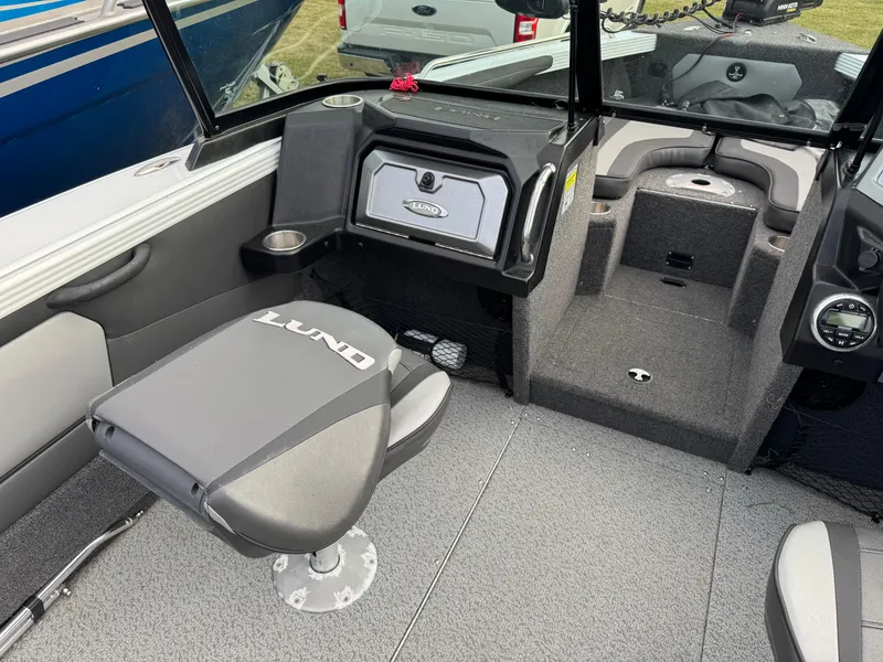 Slide: The Image of 2021 Lund 1875 Tyee boat interior with seating and storage compartments. - 12