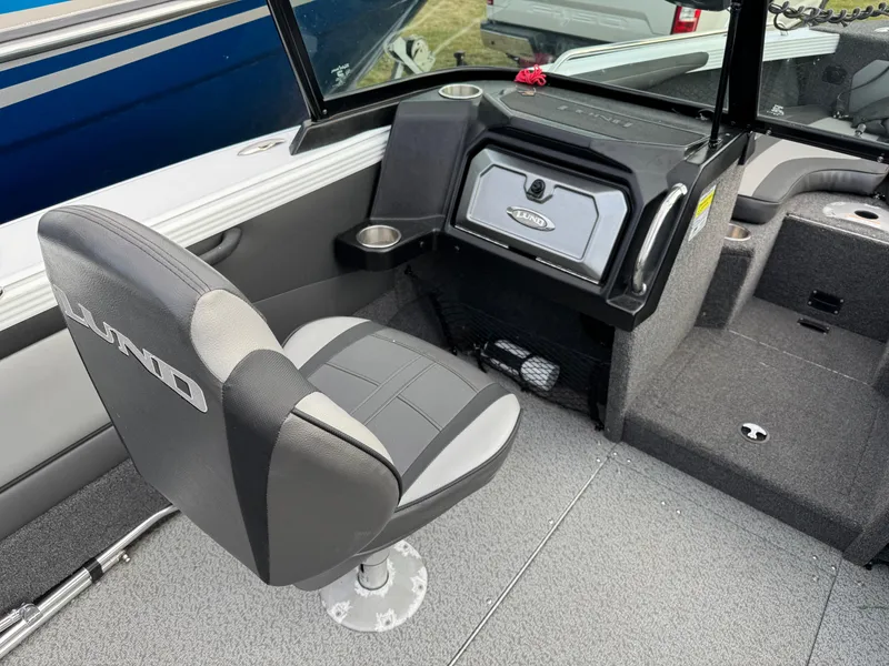 Slide: The Image of 2021 Lund 1875 Tyee boat interior with swivel seat and storage compartment. - 13