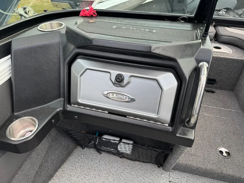 Slide: The Image of 2021 Lund 1875 Tyee boat interior with storage compartment and cup holder. - 15