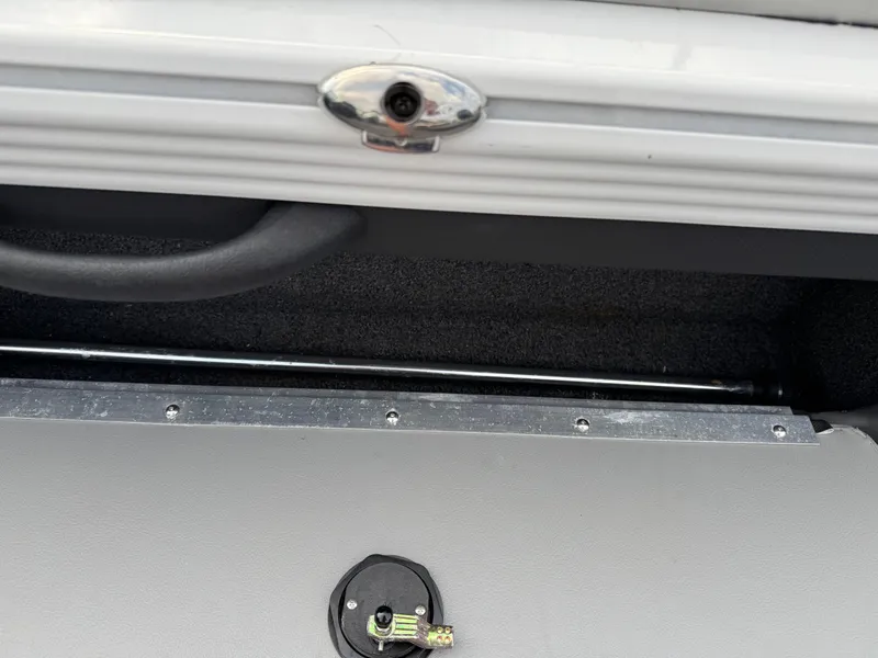 Slide: The Image of 2021 Lund 1875 Tyee boat interior detail with handle and latch. - 18