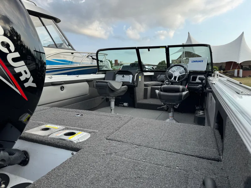 Slide: The Image of 2021 Lund 1875 Tyee boat interior with Mercury engine and Lowrance equipment. - 2