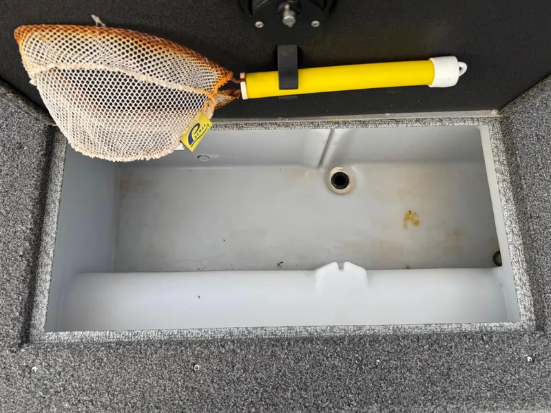 Slide: The Image of Open storage compartment in 2021 Lund 1875 Tyee boat with a fishing net. - 20