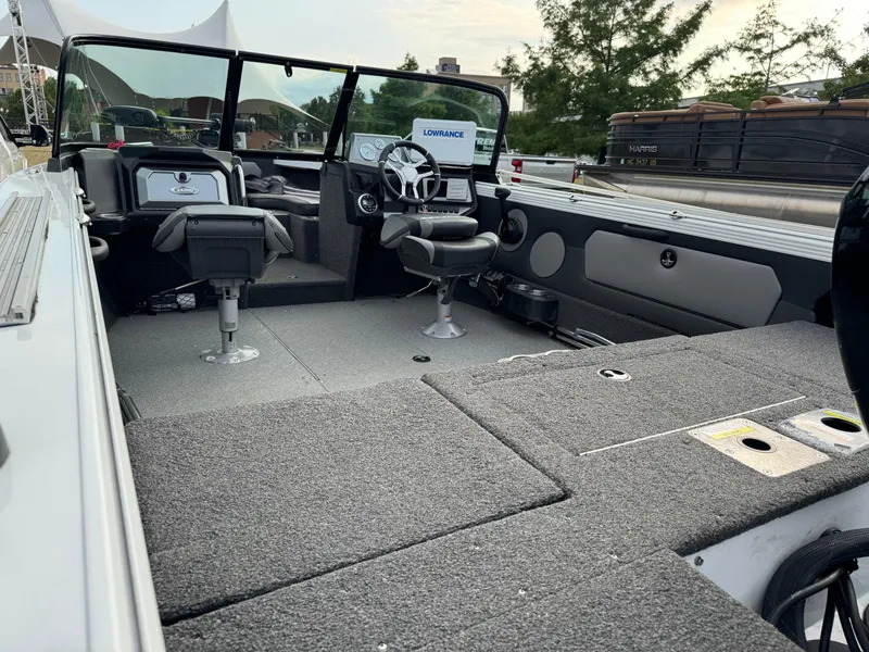 Slide: The Image of 2021 Lund 1875 Tyee boat interior with seating and control panel. - 3