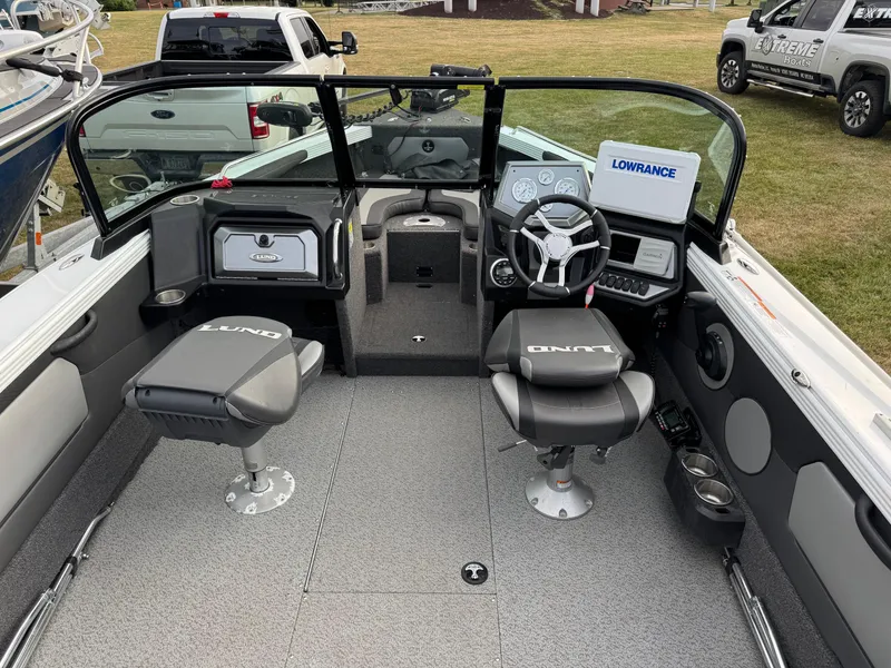 Slide: The Image of 2021 Lund 1875 Tyee boat interior with steering wheel and seating. - 7