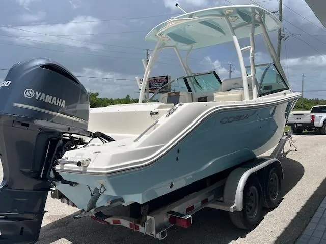 Slide: The Image of 2019 Cobia 240 Dual Console boat on trailer with Yamaha engine. - 8