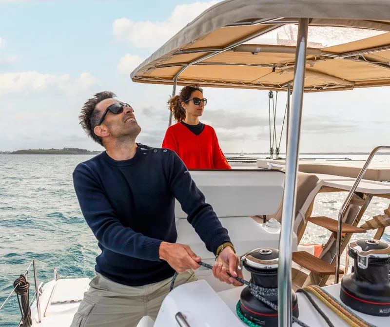 Slide: The Image of Couple sailing on Fountaine Pajot NEW 41 catamaran, 2025 model, enjoying a sunny day at sea. - 35