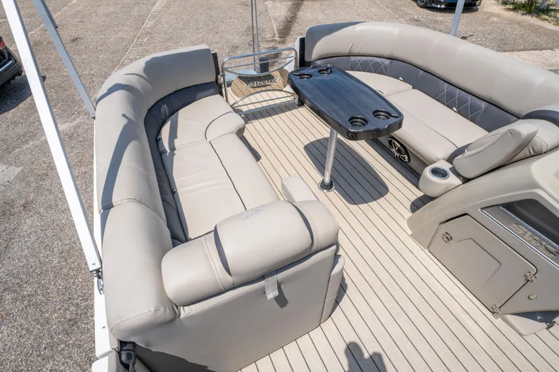 Slide: The Image of Luxurious interior of 2022 Silver Wave 2410 SW5 CLS pontoon boat with plush seating and table. - 15