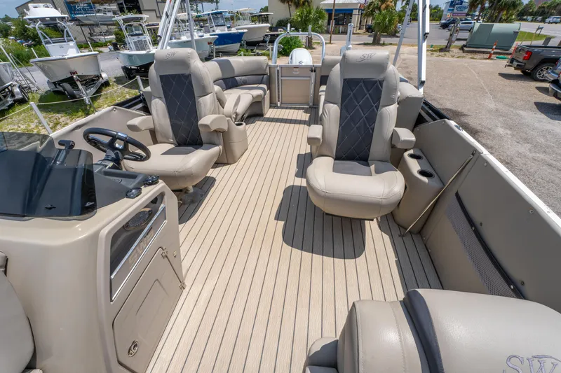 Slide: The Image of 2022 Silver Wave 2410 SW5 CLS pontoon boat interior with luxurious seating and steering console. - 16