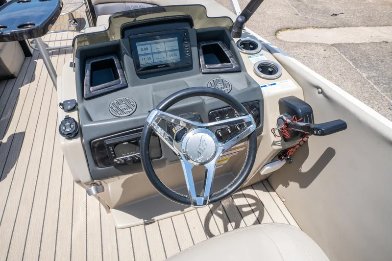 Slide: The Image of Steering console of 2022 Silver Wave 2410 SW5 CLS boat with modern controls and display. - 21