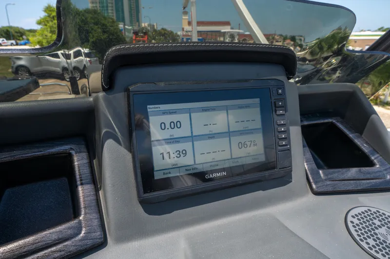 Slide: The Image of Garmin display on 2022 Silver Wave 2410 SW5 CLS boat dashboard, showing GPS and time. - 23