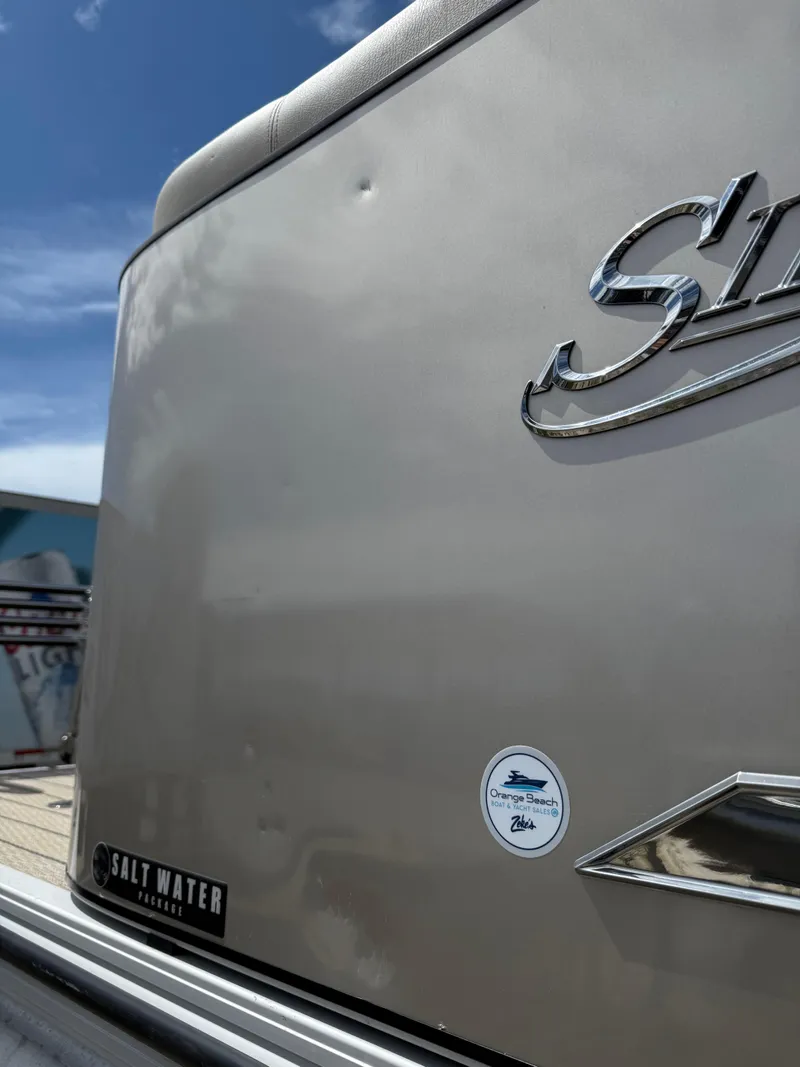 Slide: The Image of 2022 Silver Wave 2410 SW5 CLS boat with saltwater package, under a clear blue sky. - 26