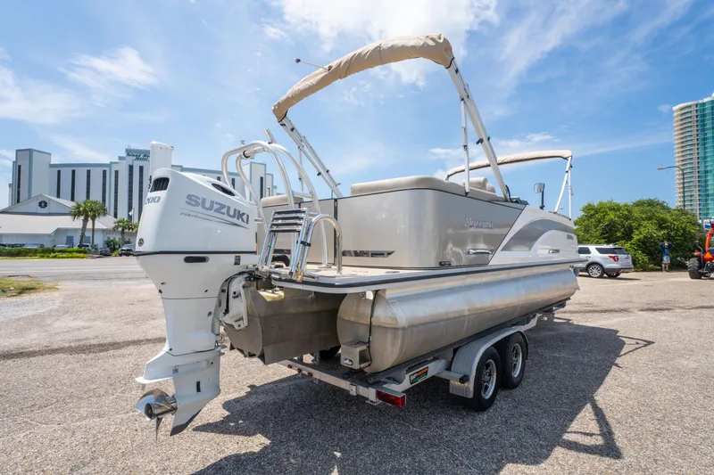 Slide: The Image of 2022 Silver Wave 2410 SW5 CLS pontoon boat with Suzuki engine on a trailer. - 7