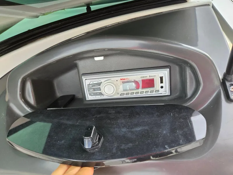 Slide: The Image of Boat stereo system in a 2012 Sea Ray 190 Sport dashboard. - 16