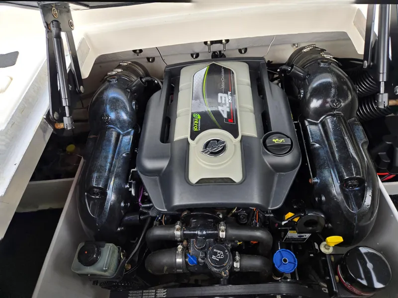 Slide: The Image of Engine of 2012 Sea Ray 190 Sport boat, showcasing MerCruiser 4.3 MPI motor. - 24