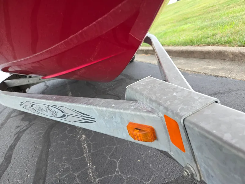 Slide: The Image of Red 2012 Sea Ray 190 Sport boat on a trailer with orange reflector. - 7