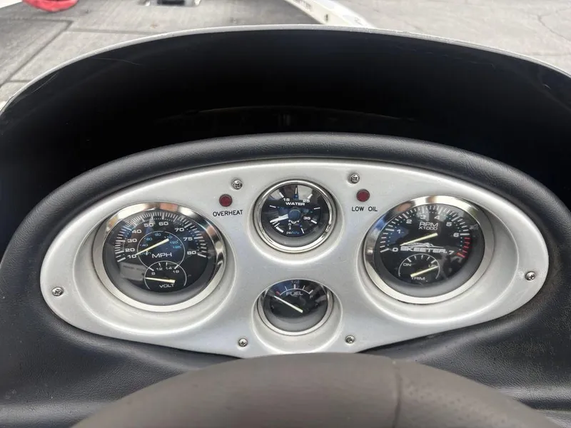 Slide: The Image of Dashboard of a 2008 Skeeter ZX200 boat with speedometer, RPM, and fuel gauges. - 15