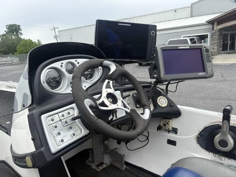 Slide: The Image of 2008 Skeeter ZX200 boat dashboard with steering wheel and electronic displays. - 16