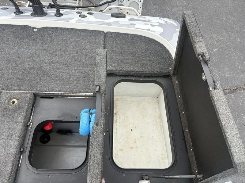 Slide: The Image of 2008 Skeeter ZX200 boat storage compartments with open hatches, showcasing interior space. - 22