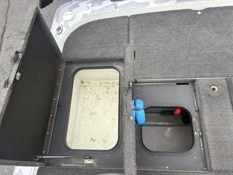 Slide: The Image of 2008 Skeeter ZX200 boat storage compartments with open hatches, showcasing interior details. - 23