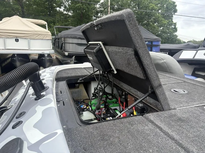 Slide: The Image of 2008 Skeeter ZX200 boat with open hatch showing internal wiring and components. - 24