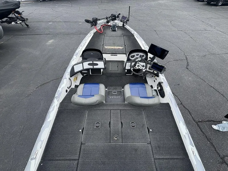 Slide: The Image of 2008 Skeeter ZX200 boat interior with dual seats, steering console, and electronic displays. - 25
