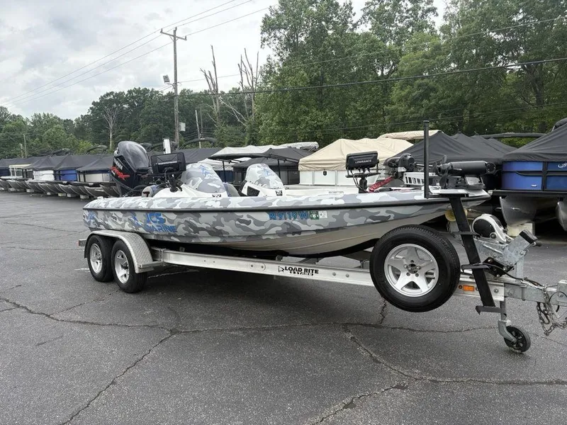 Slide: The Image of 2008 Skeeter ZX200 boat with camouflage design on a trailer in a parking lot. - 7