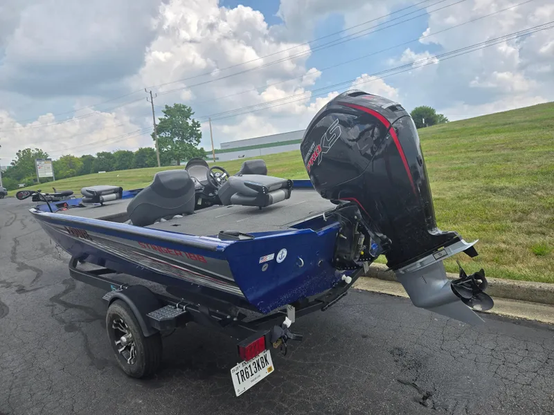 Slide: The Image of 2021 Lowe Stinger 188 boat with powerful outboard motor on a trailer. - 3