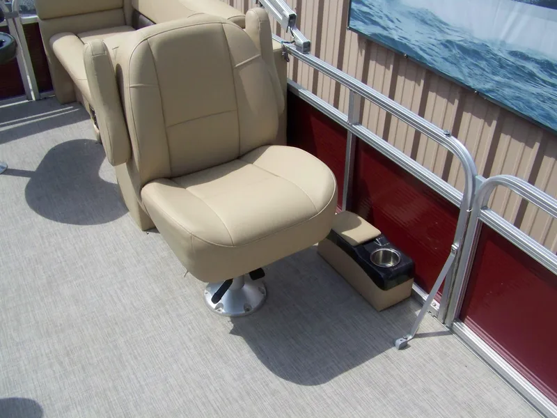 Slide: The Image of 2020 Avalon GS Quad Lounger boat seat with beige upholstery and integrated cup holder. - 10