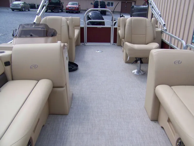 Slide: The Image of 2020 Avalon GS Quad Lounger 23' pontoon boat with beige seating and spacious deck. - 3