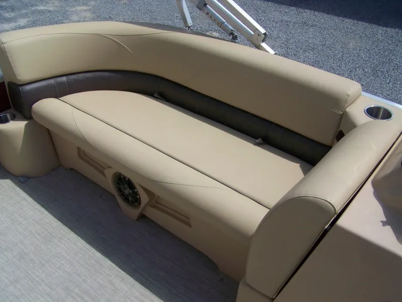 Slide: The Image of Luxurious seating on 2020 Avalon GS Quad Lounger boat, featuring beige upholstery and cup holders. - 6