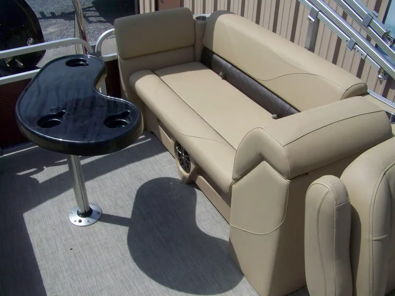 Slide: The Image of 2020 Avalon GS Quad Lounger interior with beige seating and black table. - 9