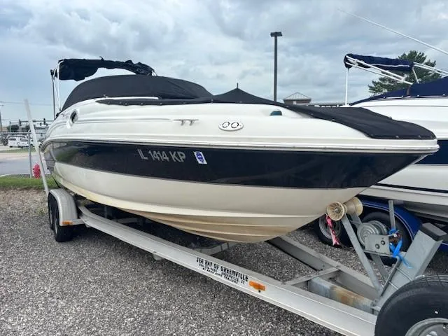 Slide: The Image of 2004 Sea Ray 240 Sundeck boat on trailer, covered and ready for transport. - 0