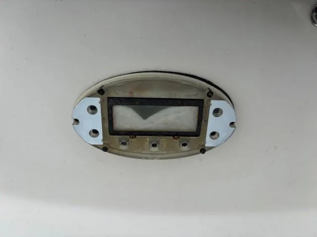 Slide: The Image of Oval-shaped boat light fixture on a 2004 Sea Ray 240 Sundeck. - 10