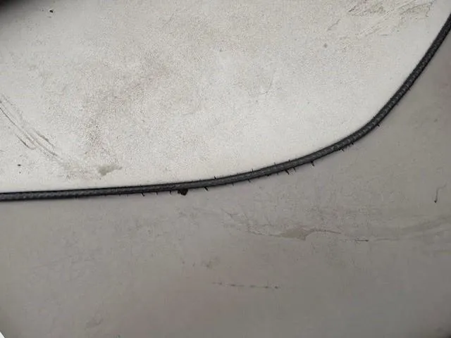 Slide: The Image of Close-up of 2004 Sea Ray 240 Sundeck boat surface with visible wear and texture. - 16