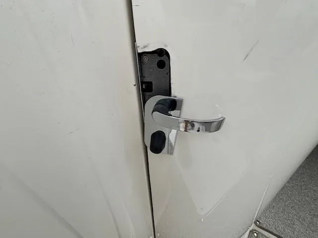 Slide: The Image of Chrome door handle on a 2004 Sea Ray 240 Sundeck boat. - 25