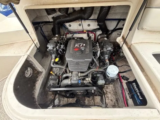 Slide: The Image of Engine compartment of a 2004 Sea Ray 240 Sundeck boat, featuring a 5.0 MPI engine. - 33