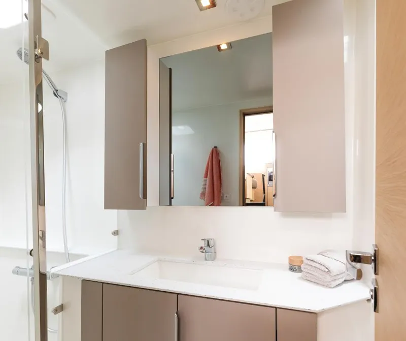 Slide: The Image of Modern bathroom interior of 2025 Fountaine Pajot NEW 41 yacht, featuring sleek cabinetry and fixtures. - 19