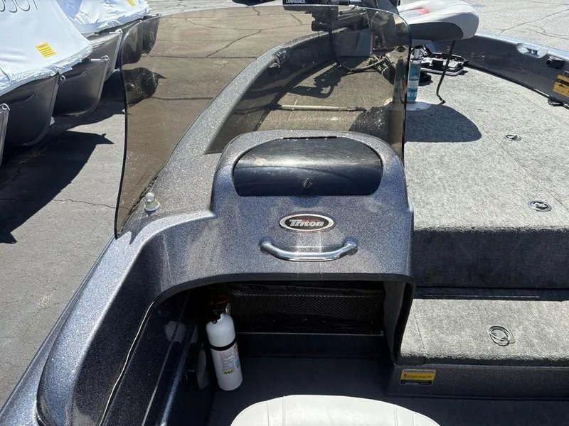 Slide: The Image of 2000 Triton TR205 DC Walleye boat interior with console and seating. - 10