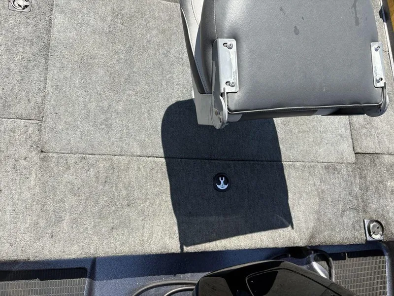 Slide: The Image of Interior of 2000 Triton TR205 DC Walleye boat with gray carpet and seat. - 20