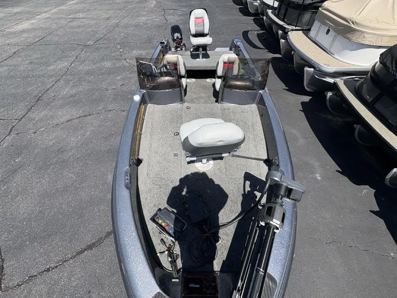 Slide: The Image of 2000 Triton TR205 DC Walleye fishing boat with seating and equipment on display. - 21