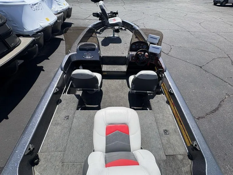 Slide: The Image of 2000 Triton TR205 DC Walleye boat interior with dual consoles and seating. - 24