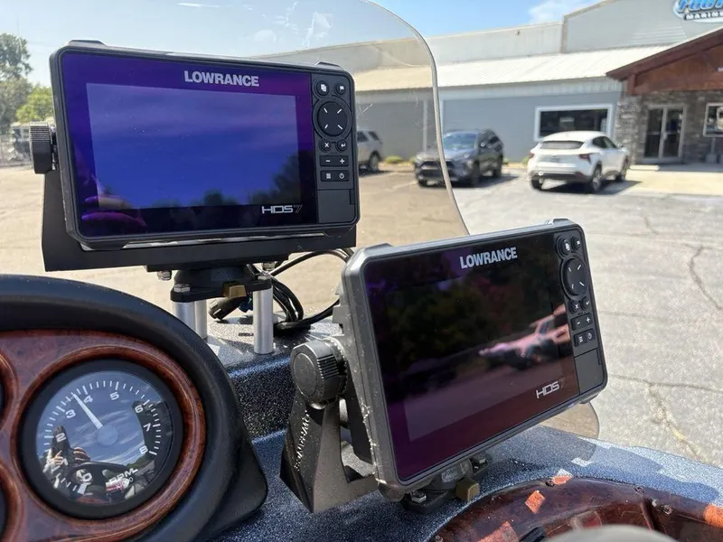 Slide: The Image of Dual Lowrance HDS7 displays on a 2000 Triton TR205 DC Walleye boat dashboard. - 25