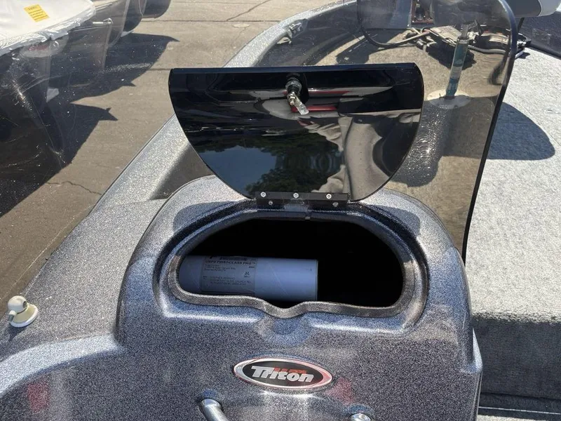 Slide: The Image of Open storage compartment on a 2000 Triton TR205 DC Walleye boat. - 7