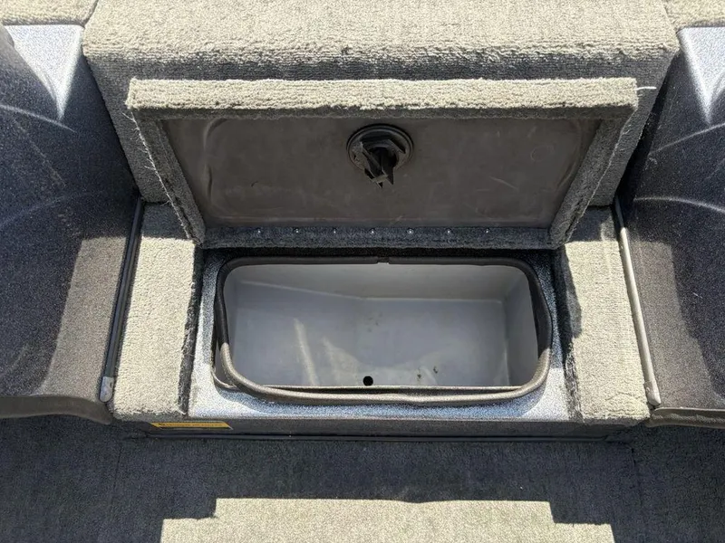 Slide: The Image of Open storage compartment in a 2000 Triton TR205 DC Walleye boat. - 8