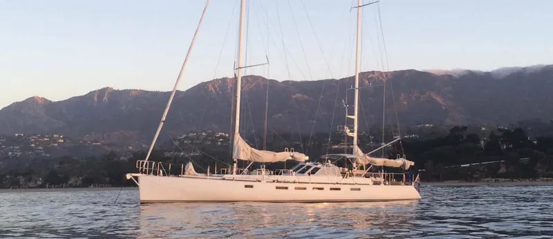The Image of Sailing yacht "Kelly Archer" 1998 on calm waters with mountainous backdrop. - 0