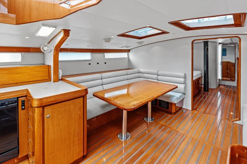 Slide: The Image of Luxurious 1998 Custom Kelly Archer yacht interior with wooden flooring and modern seating area. - 16