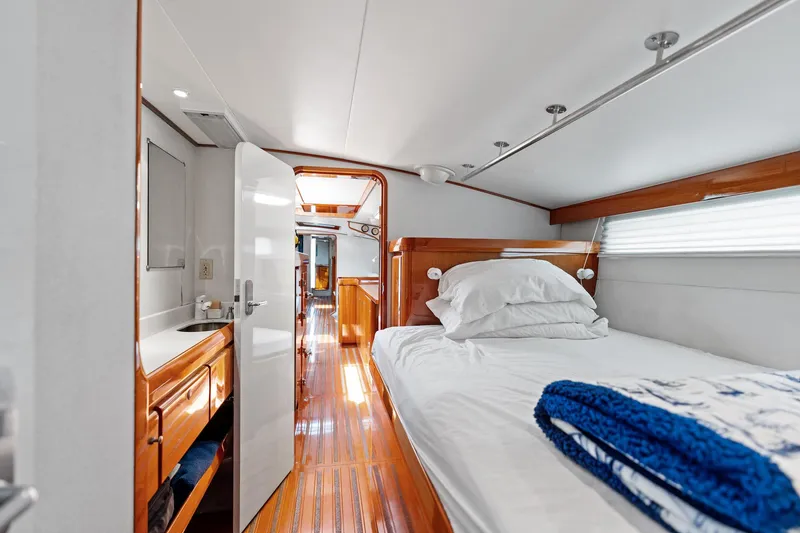 Slide: The Image of Luxurious yacht cabin interior with wooden flooring, bed, and bathroom, Custom Kelly Archer 1998 model. - 21