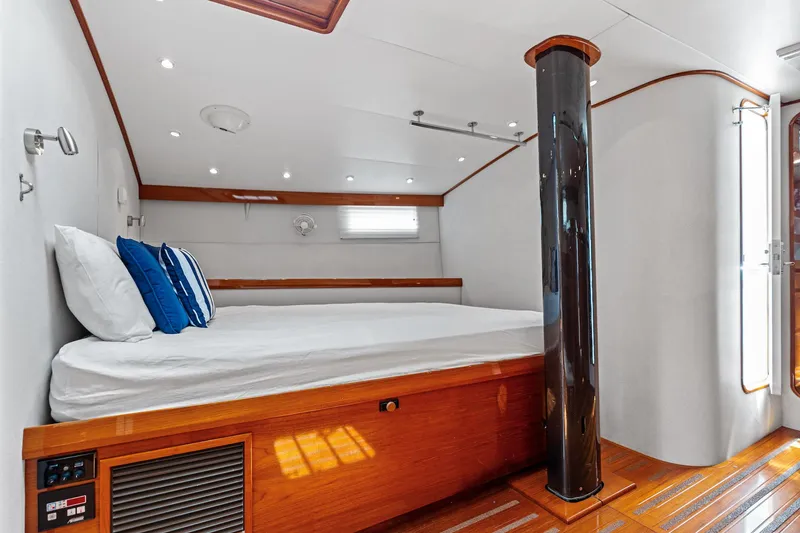 Slide: The Image of Luxurious cabin interior of 1998 Custom Kelly Archer yacht with wooden accents and cozy bedding. - 22
