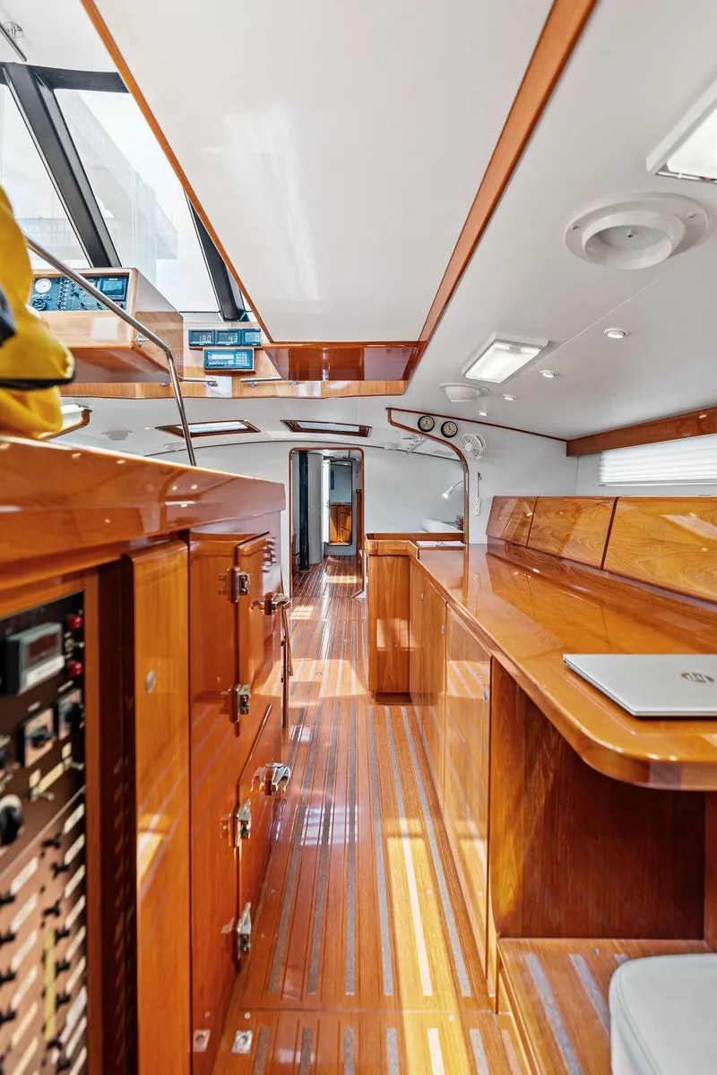 Slide: The Image of Luxurious interior of 1998 Custom Kelly Archer yacht with polished wood finishes and modern amenities. - 32