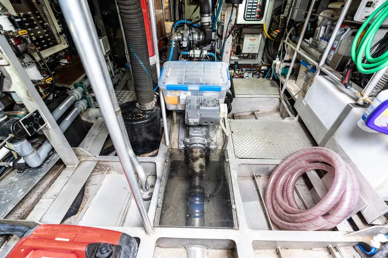 Slide: The Image of Engine room of 1998 Custom Kelly Archer boat with organized equipment and storage. - 41